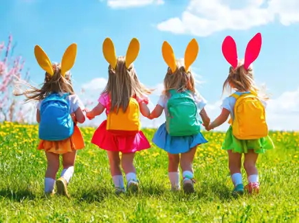 Four girls in bunny ears joyfully stroll through a vibrant field during Easter celebrations
