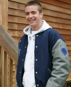 Man in wool jacket with hoodie underneath it