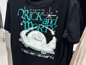 Black t-shirt with turquoise, white and gray printing